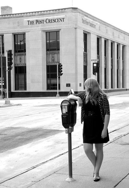 Jessica Bedore admiring the Post Crescent Building in Appleton, Wis.